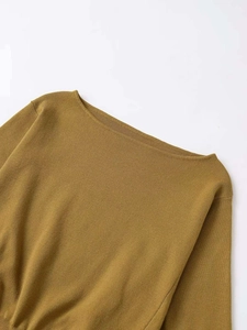 Detail of boat neck mustard yellow fine knit sweater with premium ribbed texture