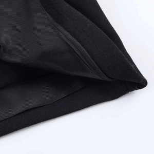 Detailed close-up of high-quality black wool fabric and twill lining on jacket