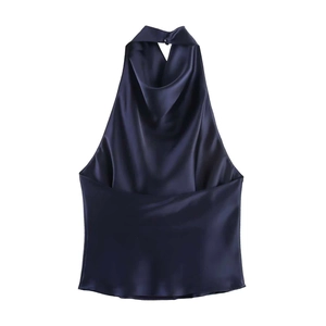 Detail of navy blue satin halter top with a graceful draped neckline and glossy texture