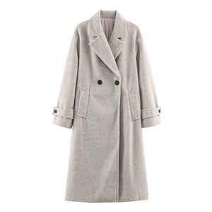 Detail of grey wool coat showing double-breasted buttons and classic lapel collar