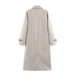 Detail view of the back seam and buttoned cuff on this stylish grey wool coat