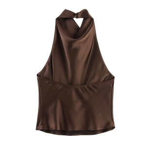 Detail of dark brown satin halter top featuring silky texture and elegant draped neckline