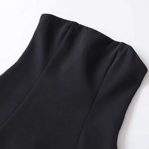 Slim fit black strapless midi dress featuring structured seams and elegant bodycon silhouette