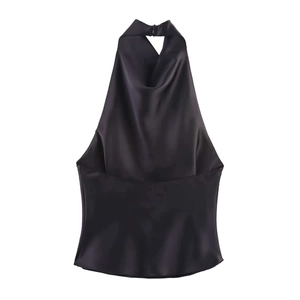 Detail view of black silk satin halter top with elegant cowl neck and open back design