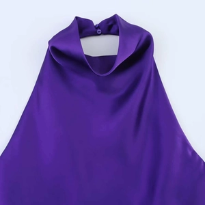 Macro detail of purple satin halter top neck with elegant silk fabric texture and buttons