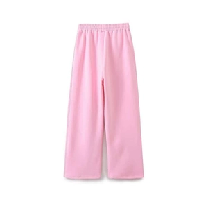 Detailed view of pink wide-leg sweatpants featuring an elasticated waist and soft fabric