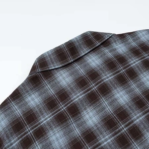 Classic blue and brown checkered long sleeve shirt featuring a vintage lapel collar