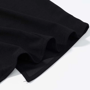 Macro detail of high-quality black chiffon fabric texture with neat stitched edges