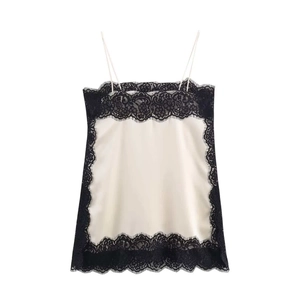 Close-up of elegant eyelash lace trim on silk texture camisole top with black lace