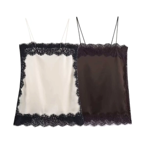 Detail of silk-satin camisole featuring eyelash lace trim and thin spaghetti straps