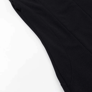 Close-up of side pocket and neat stitching on black textured bodycon dress