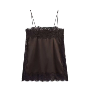 Close-up of black silk satin tank top with delicate floral lace trim and spaghetti straps
