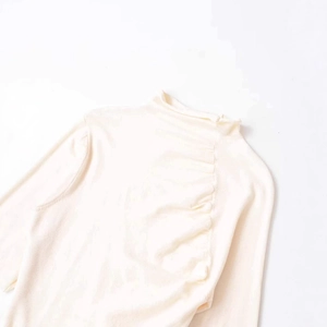 Chic off-white long sleeve turtleneck top with stylish ruching detail and soft texture