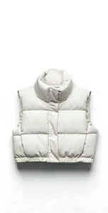 Close-up of quilted cream cropped puffer vest with windproof high collar and elastic hem
