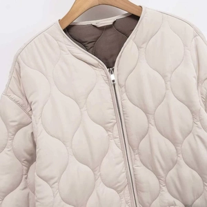 Women beige quilted jacket with onion-stitch pattern and contrast dark brown lining