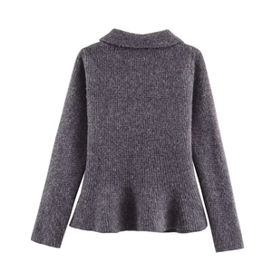 Detailed back view of charcoal grey knit sweater featuring a peplum hem and texture
