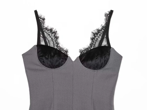 Detail of grey slim fit bodysuit featuring black velvet cups and delicate lace trim