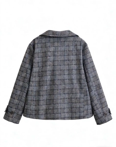 Detail of classic glen plaid pattern and tailored back of the cropped blazer jacket