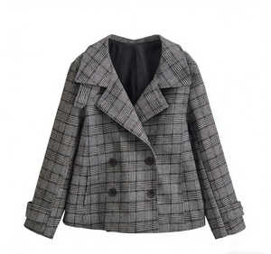 Detailed view of the double-breasted closure and fabric texture on plaid cropped jacket