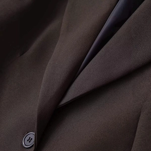 Women's tailored slim fit dark brown blazer with textured fabric and single button closure