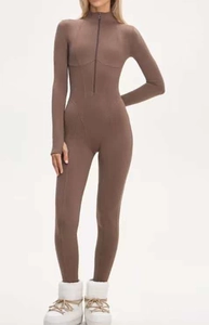 Detail view of mocha slim fit jumpsuit with half-zip collar and sculpting seam design