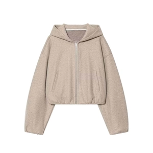Women's beige zip-up hoodie set featuring dropped shoulders and a minimalist knit texture