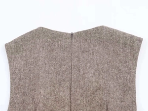 Close-up of the grey wool blend fabric texture and invisible back zipper on the dress
