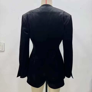 Minimalist black velvet V-neck slim fit long sleeve romper seen from the back view