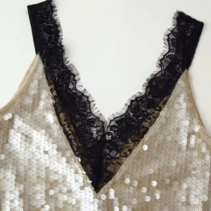 Sparkling gold sequin slip dress for women featuring V-neckline with black eyelash lace trim