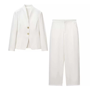 Minimalist white two-piece business suit with gold buttons for professional office wear