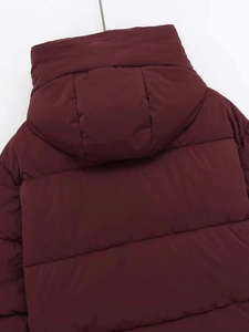 Rear view of wine red hooded puffer jacket with horizontal quilting on matte fabric
