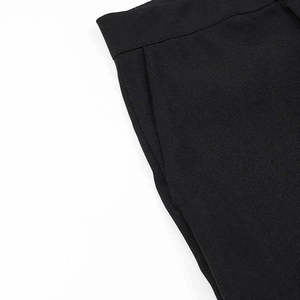 Detail showing side pockets and waistband of black slim-fit suit trousers for women