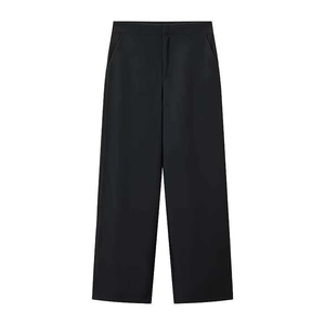 Detail view of high-waisted black straight-leg trousers with sleek side pockets