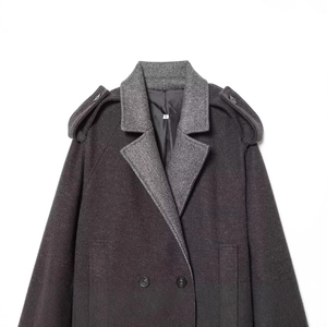 Deep grey minimalist wool coat featuring lapel collar and epaulettes in a flat lay view