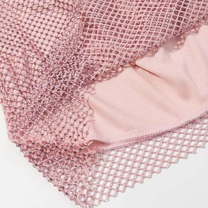 Detail of pink mesh fabric with rhinestone embellishments and inner lining for women