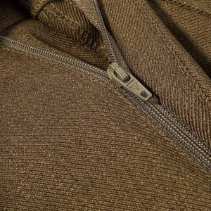 Macro shot of durable metal zipper and brown twill fabric on fashion blazer jacket