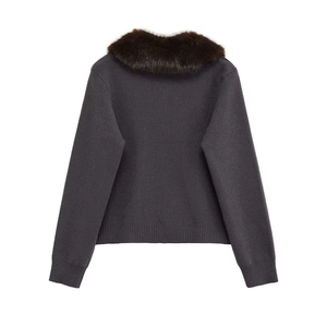 Detail view of the soft faux fur collar and knit texture on this dark grey cardigan jacket