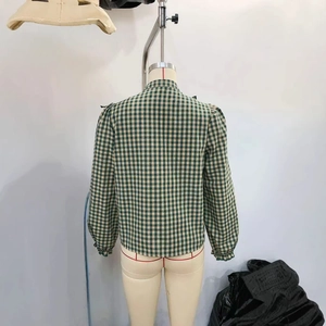 Women's green gingham check long sleeve shirt with vintage puff sleeves on mannequin