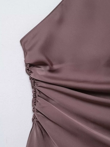 Detail of satin silk fabric with elegant ruched side texture in dusty rose color