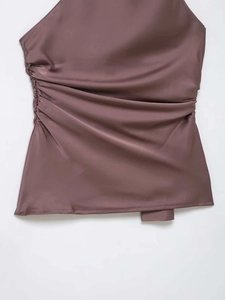 Detailed view of the elegant mauve satin fabric with side ruching and glossy finish