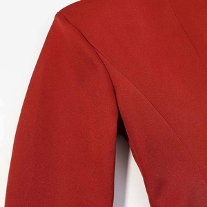 Detailed view of the shoulder seam stitching on this red slim fit blazer for women