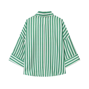 Back view of a green and white vertical striped shirt with relaxed wide half-sleeves