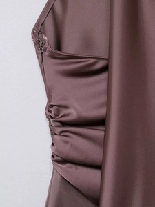 Detail of invisible zipper and side ruching on silk satin dusty pink halter top