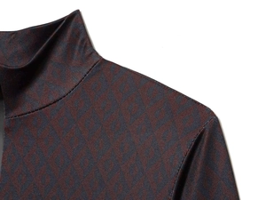 Close-up of geometric diamond knit pattern on high neck long sleeve slim bodysuit