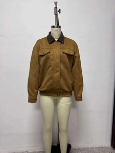 Detailed view of brown faux suede jacket featuring dark corduroy collar and cargo pockets