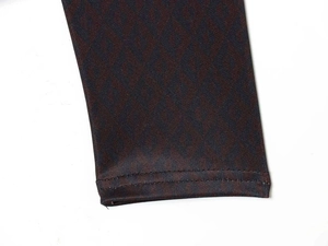 Detail of diamond pattern knit fabric with durable double-needle stitching on cuffs