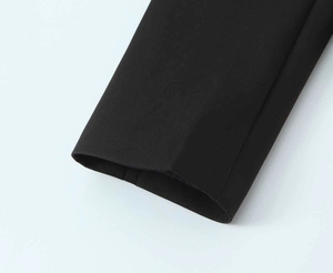 Close-up detail of smooth fabric and precise stitching on black suit jacket cuffs