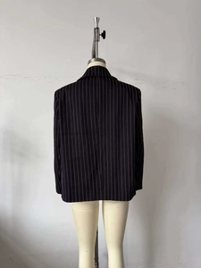 Rear view of striped black blazer with fine vertical lines and a structured fit