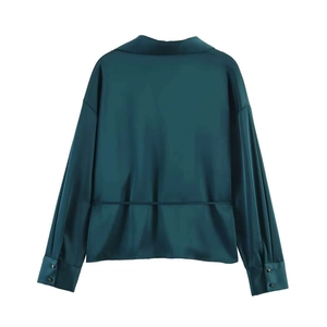 Back view of dark teal satin shirt featuring a thin waist tie and smooth silk texture