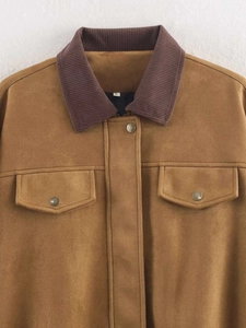 Detail of brown faux suede jacket with corduroy collar and metal snap buttons